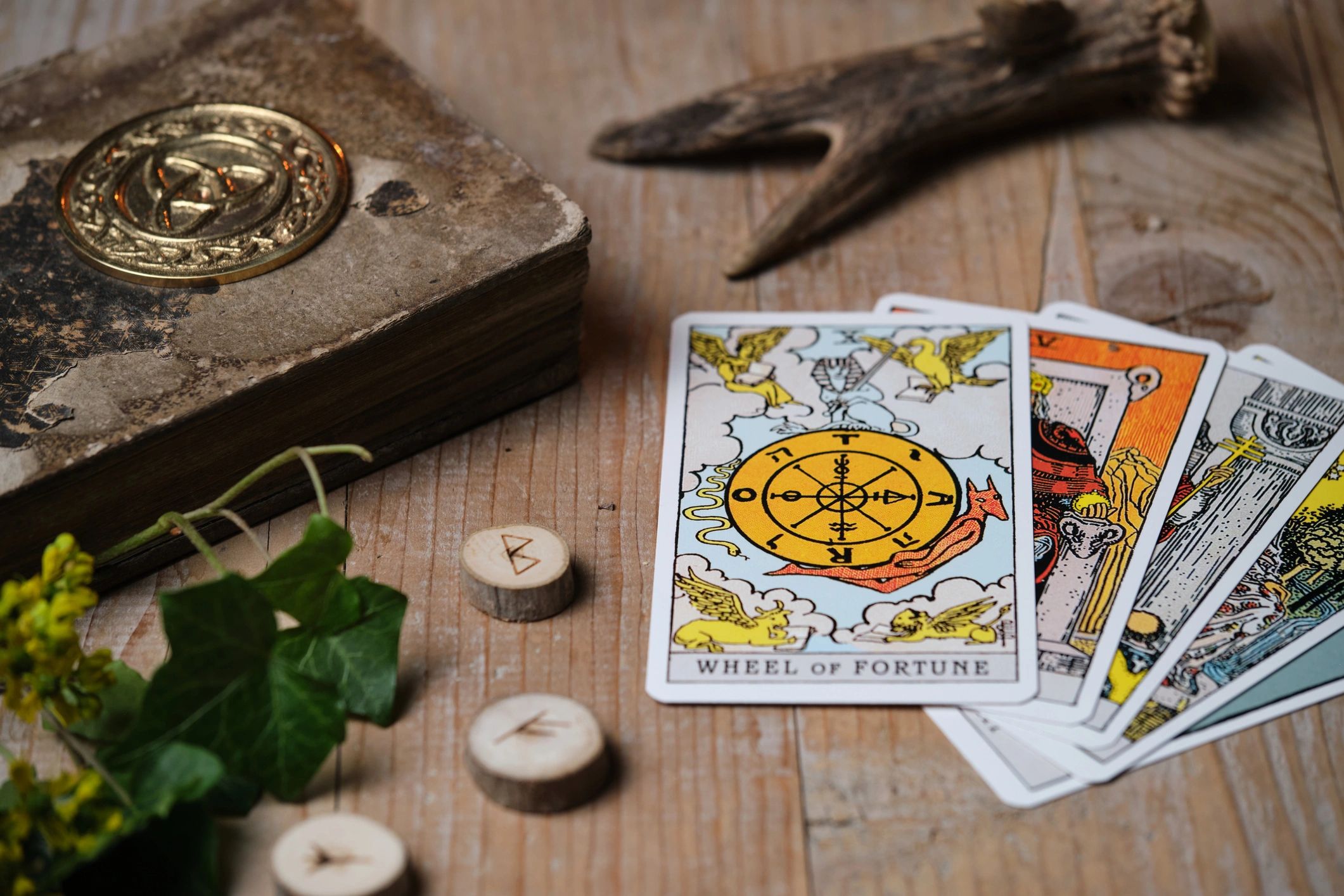 Tarot cards arranged on a wooden table