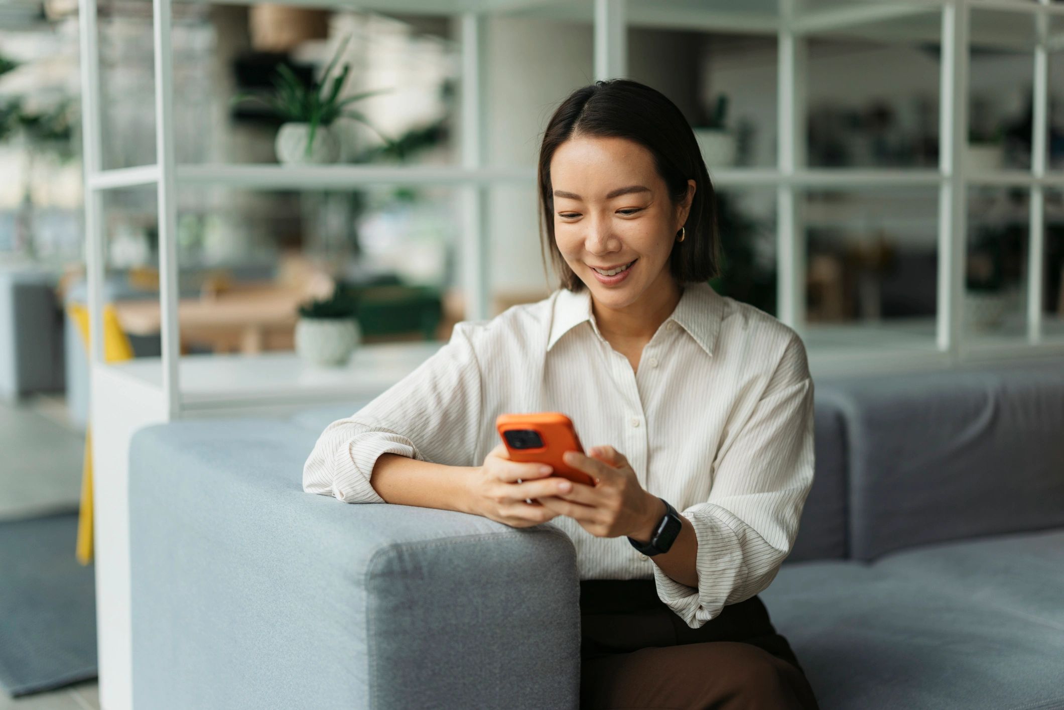 Woman speaking on the phone with a calm smile